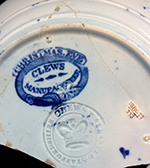 Pearlware London-shape cup and saucer reverse printed in dark blue. Printed mark on reverse of saucer with Christmas Eve (pattern name) and manufacturer (Clews). 4” cup rim diameter; 2.5” cup height; 5.75” saucer rim diameter; 1” saucer height. Note impressed asterisk mark in center of printed mark. Also impressed maker’s mark for James and Ralph Clews (1814-1834), Cobridge.